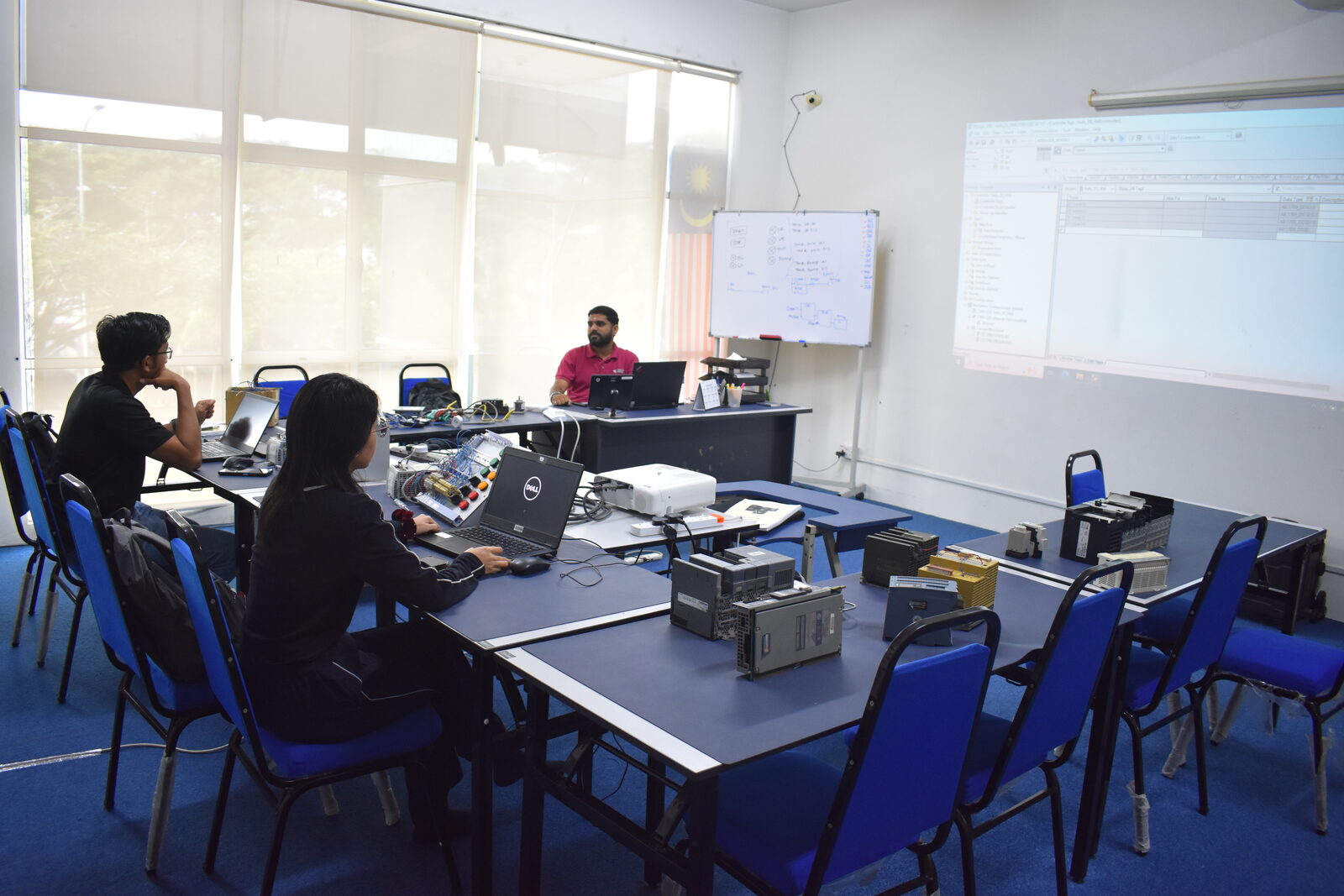 Participant working hands-on during Allen-Bradley training