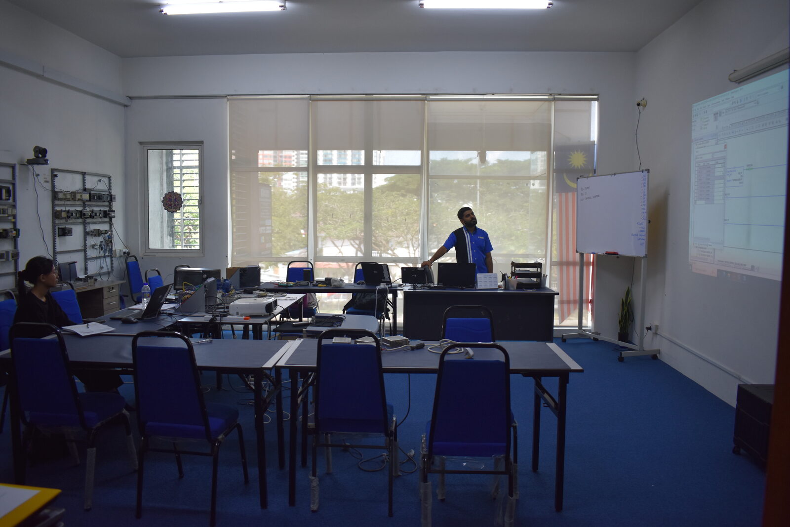 Instructor guiding Allen-Bradley CompactLogix and ControlLogix hardware setup during the training